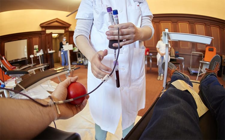 A nurse collects samples at a blood donation centre during the outbreak of the coronavirus disease